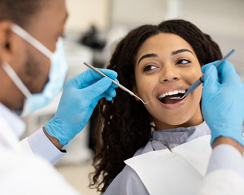 Woman smiling during dental exam