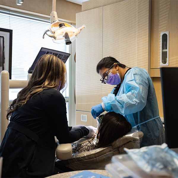 Dentist showing patient a tablet