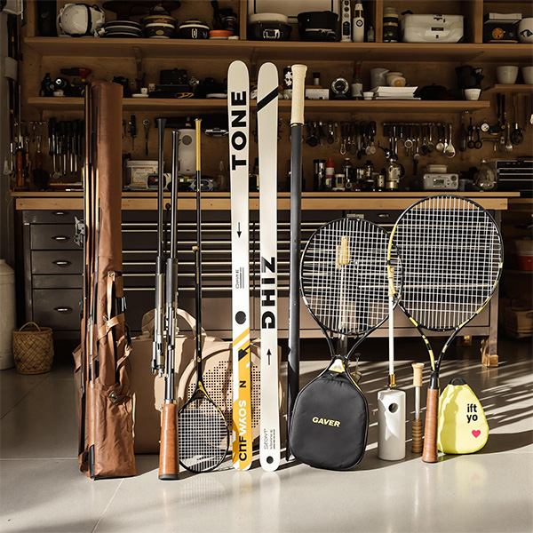 Close up of tennis racket and tennis balls