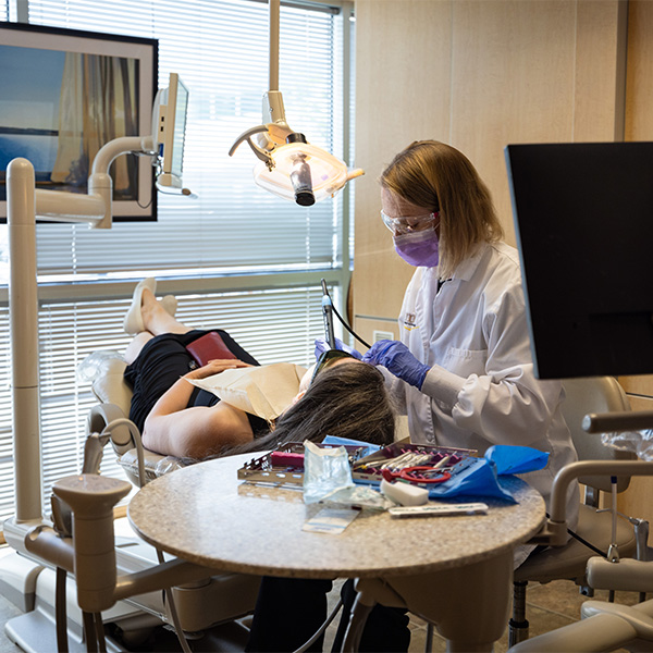 Man sitting in dental chair about to have teeth examined