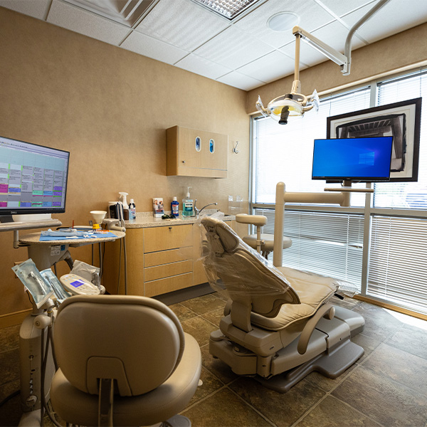 Dentist showing patient a tablet